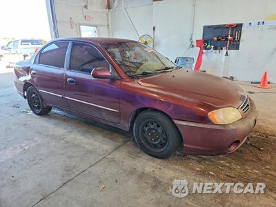 Czwarte zdjęcie samochodu z boku: 2002 KIA SPECTRA BASE VIN:KNAFB121925129082 - miniatura