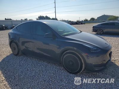 Czwarte zdjęcie samochodu z boku: 2023 TESLA MODEL Y VIN:7SAYGDEF4PF855124 - miniatura