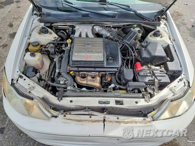 Zdjęcie 11 z 12 samochodu: 2002 TOYOTA AVALON XLS VIN:4T1BF28B12U251612 - miniatura