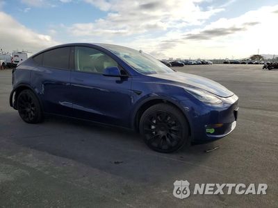 Czwarte zdjęcie samochodu z boku: 2023 TESLA MODEL Y VIN:7SAYGAEE9PF583319 - miniatura