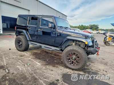 Czwarte zdjęcie samochodu z boku: 2013 JEEP WRANGLER UNLIMITED RUBICON VIN:1C4BJWFGXDL571805 - miniatura