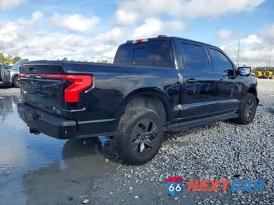 Trzecie zdjęcie samochodu z tyłu: 2024 FORD F150 LIGHTNING LARIAT VIN:1FT6W5L76RWG08517 - miniatura