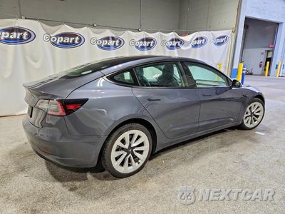 Trzecie zdjęcie samochodu z tyłu: 2022 TESLA MODEL 3 VIN:5YJ3E1EAXNF185690 - miniatura