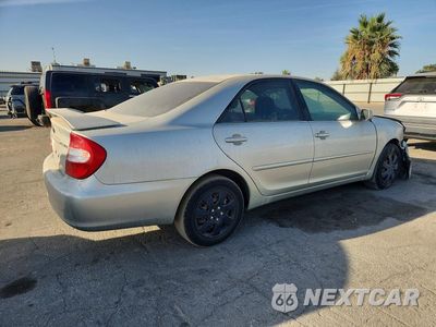 Trzecie zdjęcie samochodu z tyłu: 2004 TOYOTA CAMRY LE VIN:JTDBE32K040280499 - miniatura