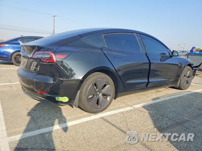 Trzecie zdjęcie samochodu z tyłu: 2023 TESLA MODEL 3 VIN:5YJ3E1EB2PF632458 - miniatura