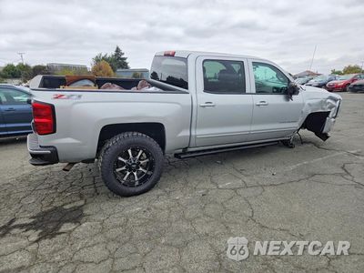 Trzecie zdjęcie samochodu z tyłu: 2017 CHEVROLET SILVERADO K1500 LT VIN:3GCUKREC3HG125035 - miniatura