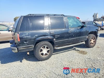 Trzecie zdjęcie samochodu z tyłu: 1997 GMC YUKON VIN:1GKEK13R7VJ700085 - miniatura