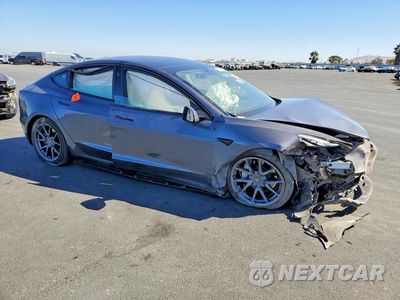 Czwarte zdjęcie samochodu z boku: 2023 TESLA MODEL 3 VIN:5YJ3E1EA9PF695581 - miniatura