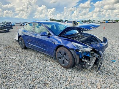 Czwarte zdjęcie samochodu z boku: 2023 TESLA MODEL 3 VIN:5YJ3E1EA1PF581154 - miniatura