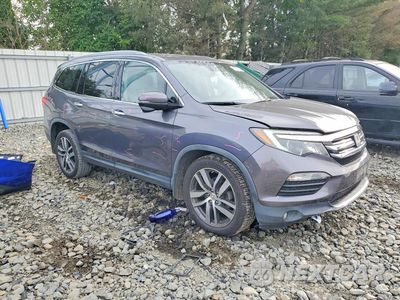 Czwarte zdjęcie samochodu z boku: 2017 HONDA PILOT TOURING VIN:5FNYF6H98HB023398 - miniatura
