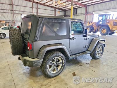Trzecie zdjęcie samochodu z tyłu: 2016 JEEP WRANGLER SAHARA VIN:1C4AJWBG0GL167580 - miniatura