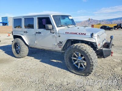 Czwarte zdjęcie samochodu z boku: 2011 JEEP WRANGLER UNLIMITED RUBICON VIN:1J4BA6H15BL585238 - miniatura