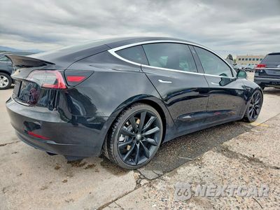 Trzecie zdjęcie samochodu z tyłu: 2019 TESLA MODEL 3 VIN:5YJ3E1EB0KF384770 - miniatura