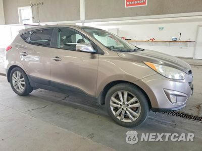 Czwarte zdjęcie samochodu z boku: 2011 HYUNDAI TUCSON LIMITED VIN:KM8JUCAC6BU312656 - miniatura
