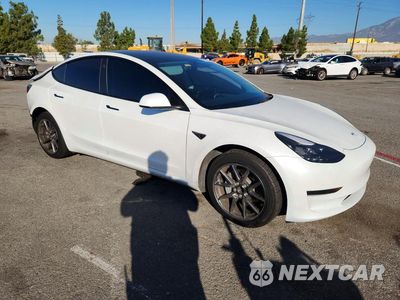 Czwarte zdjęcie samochodu z boku: 2023 TESLA MODEL 3 VIN:5YJ3E1EA0PF548016 - miniatura