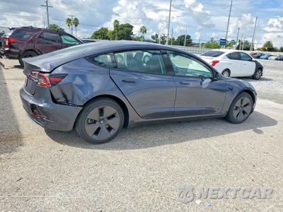 Trzecie zdjęcie samochodu z tyłu: 2023 TESLA MODEL 3 VIN:5YJ3E1EA5PF698297 - miniatura