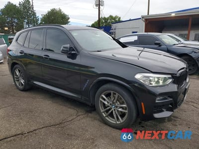 Czwarte zdjęcie samochodu z boku: 2021 BMW X3 XDRIVE30E VIN:5UXTS1C05M9D75295 - miniatura