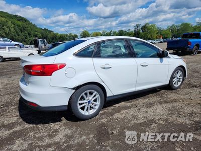 Trzecie zdjęcie samochodu z tyłu: 2018 FORD FOCUS SE VIN:1FADP3F21JL279892 - miniatura