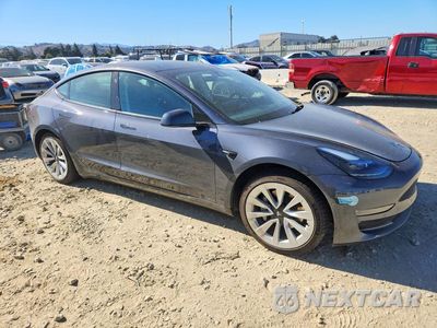 Czwarte zdjęcie samochodu z boku: 2022 TESLA MODEL 3 VIN:5YJ3E1EB5NF297953 - miniatura