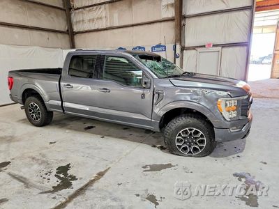 Czwarte zdjęcie samochodu z boku: 2022 FORD F150 SUPERCREW VIN:1FTFW1E88NFB87957 - miniatura