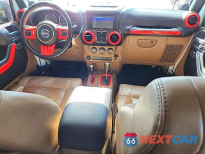 Zdjęcie 8 z 13 samochodu: 2011 JEEP WRANGLER UNLIMITED SAHARA VIN:1J4BA5H19BL563480 - miniatura