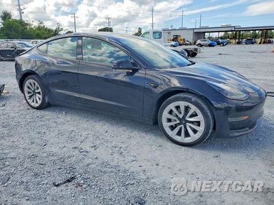 Czwarte zdjęcie samochodu z boku: 2022 TESLA MODEL 3 VIN:5YJ3E1EB8NF199189 - miniatura