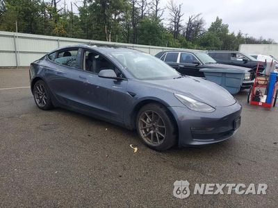 Czwarte zdjęcie samochodu z boku: 2023 TESLA MODEL 3 VIN:5YJ3E1EB2PF687721 - miniatura