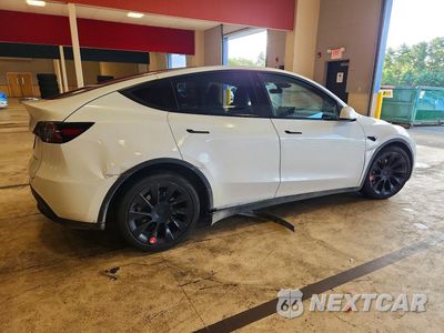 Trzecie zdjęcie samochodu z tyłu: 2023 TESLA MODEL Y VIN:7SAYGAEE5PF808402 - miniatura