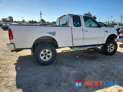 Trzecie zdjęcie samochodu z tyłu: 2000 FORD F150 VIN:1FTRX17L0YKA27272 - miniatura
