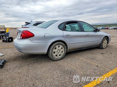 Trzecie zdjęcie samochodu z tyłu: 2002 FORD TAURUS LX VIN:1FAFP52292G210484 - miniatura