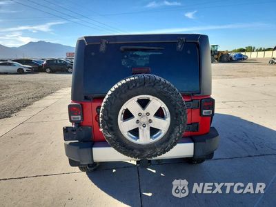 Zdjęcie 6 z 12 samochodu: 2011 JEEP WRANGLER UNLIMITED SAHARA VIN:1J4HA5H1XBL534497 - miniatura