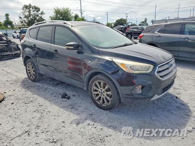 Czwarte zdjęcie samochodu z boku: 2017 FORD ESCAPE TITANIUM VIN:1FMCU0J9XHUE65142 - miniatura