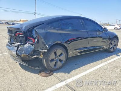 Trzecie zdjęcie samochodu z tyłu: 2023 TESLA MODEL 3 VIN:5YJ3E1EA1PF556951 - miniatura