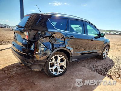 Trzecie zdjęcie samochodu z tyłu: 2017 FORD ESCAPE TITANIUM VIN:1FMCU0J96HUC02162 - miniatura