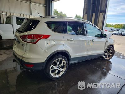Trzecie zdjęcie samochodu z tyłu: 2016 FORD ESCAPE TITANIUM VIN:1FMCU9J95GUC59357 - miniatura