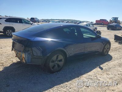 Trzecie zdjęcie samochodu z tyłu: 2023 TESLA MODEL 3 VIN:5YJ3E1EA0PF645555 - miniatura