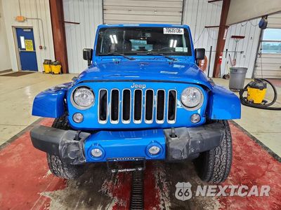 Piąte zdjęcie samochodu w środku: 2016 JEEP WRANGLER UNLIMITED SAHARA VIN:1C4BJWEG9GL230773 - miniatura