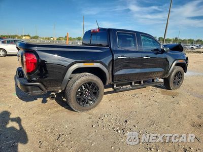 Trzecie zdjęcie samochodu z tyłu: 2024 GMC CANYON DENALI VIN:1GTP6FEK7R1306677 - miniatura