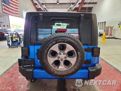 Zdjęcie 6 z 12 samochodu: 2016 JEEP WRANGLER UNLIMITED SAHARA VIN:1C4BJWEG9GL230773 - miniatura