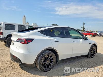 Trzecie zdjęcie samochodu z tyłu: 2023 TESLA MODEL Y VIN:7SAYGDEE7PA065353 - miniatura