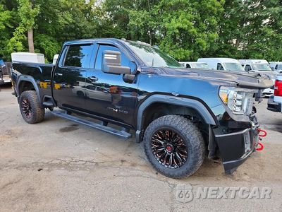 Czwarte zdjęcie samochodu z boku: 2020 GMC SIERRA K2500 AT4 VIN:1GT49PE78LF313725 - miniatura