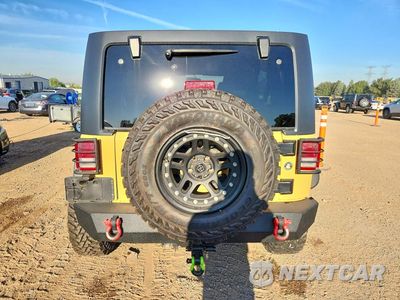 Zdjęcie 6 z 12 samochodu: 2014 JEEP WRANGLER UNLIMITED RUBICON VIN:1C4HJWFGXEL246678 - miniatura