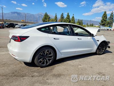 Trzecie zdjęcie samochodu z tyłu: 2021 TESLA MODEL 3 VIN:5YJ3E1EA4MF987490 - miniatura