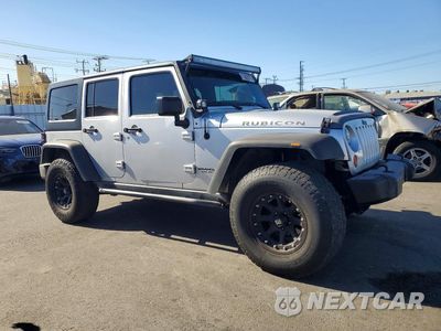 Czwarte zdjęcie samochodu z boku: 2012 JEEP WRANGLER UNLIMITED RUBICON VIN:1C4HJWFG5CL211172 - miniatura