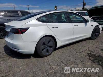 Trzecie zdjęcie samochodu z tyłu: 2023 TESLA MODEL 3 VIN:5YJ3E1EA8PF462727 - miniatura