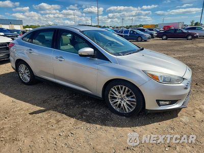 Czwarte zdjęcie samochodu z boku: 2017 FORD FOCUS TITANIUM VIN:1FADP3J24HL291665 - miniatura