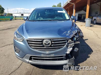 Piąte zdjęcie samochodu w środku: 2016 MAZDA CX5 VIN:JM3KE4DY4G0871373 - miniatura
