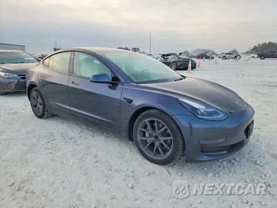 Czwarte zdjęcie samochodu z boku: 2023 TESLA MODEL 3 VIN:5YJ3E1EA7PF496979 - miniatura