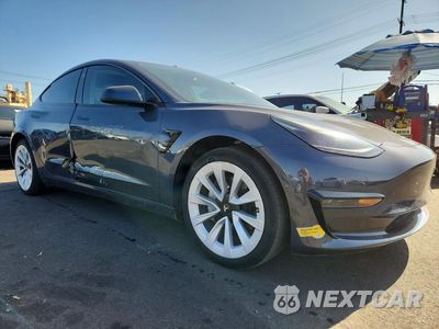 Czwarte zdjęcie samochodu z boku: 2022 TESLA MODEL 3 VIN:5YJ3E1EA0NF324886 - miniatura