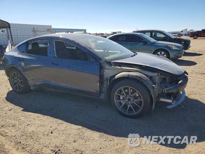 Czwarte zdjęcie samochodu z boku: 2021 TESLA MODEL 3 VIN:5YJ3E1EA2MF100436 - miniatura